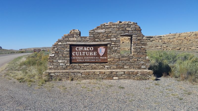 Sign for Chaco Culture Historical Park set in sandstone bricks.