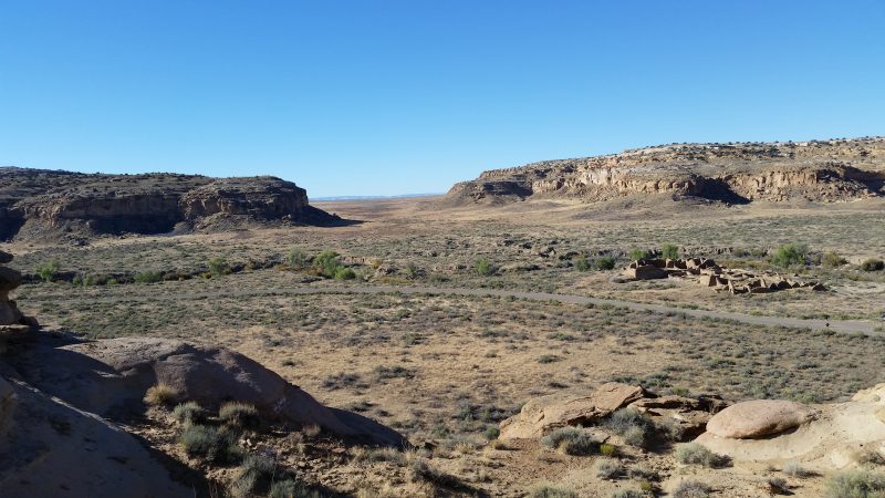 A view of the South Gap of Chaco Canyon against a clear blue sky.