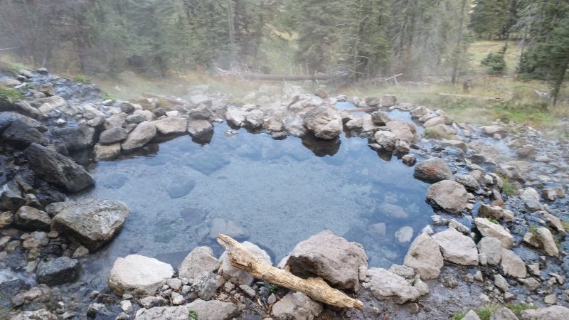 Pools of clear, steamy water from a remote hot spring New Mexico hikers come to for relaxing.