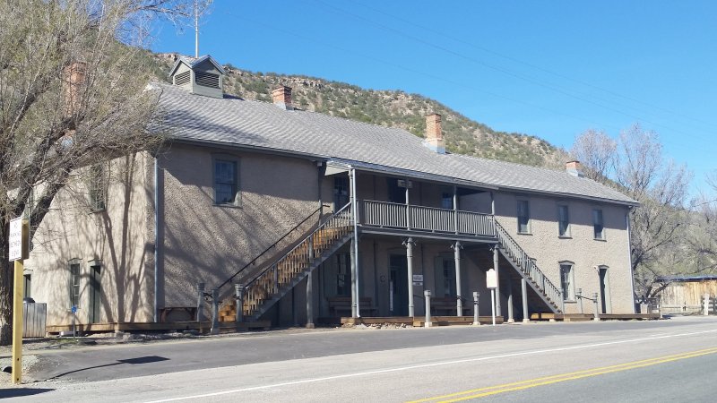 The front of the two-story stucco Lincoln County Jail in New Mexico.