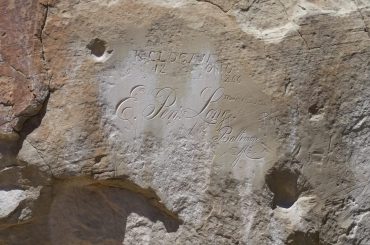 Ornate carved signatures on Inscription Rock at El Morro National Monument.
