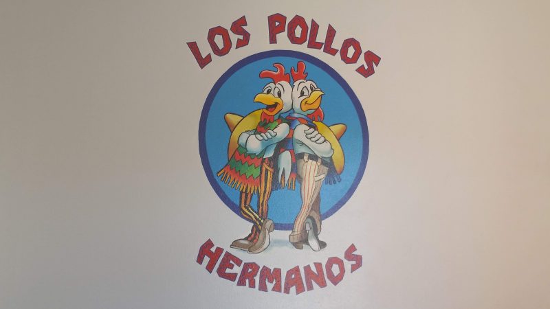 The Los Pollos Hermanos logo from the Breaking Bad television series on a wall at the original filming location.