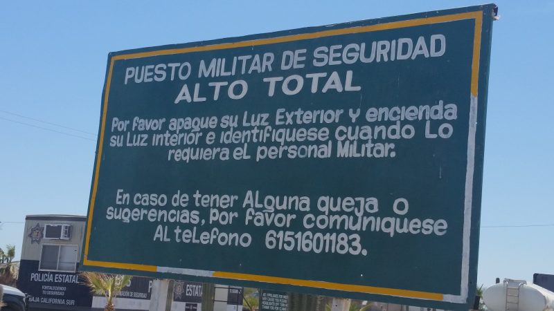 A military checkpoint sign along the road in Baja California.
