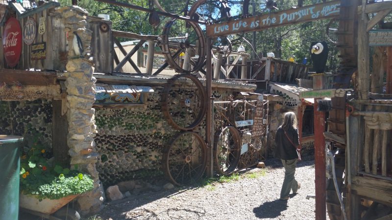 A woman walking through the old west town at Tinkertown Museum, located on the Turquoise Trail in New Mexico.