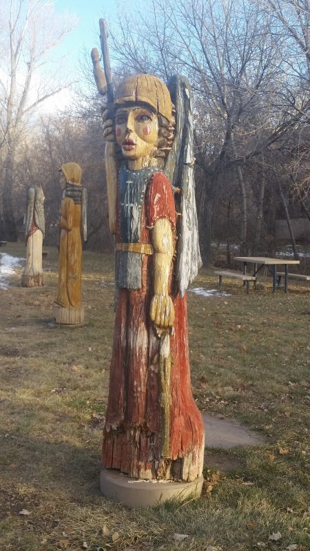 Sculpted and painted tree trunks of angelic figures.