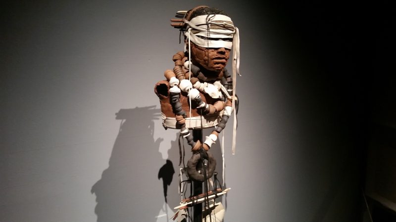 A stylized, industrial-looking terracotta figure from artist Rose B. Simpson on display at Museum hill in Santa Fe.