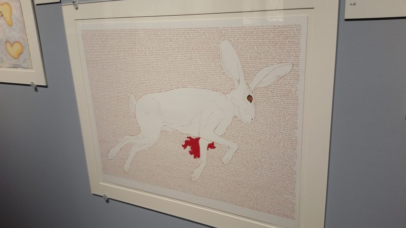 A piece pf artwork at Museum Hill in Santa Fe from artist Bob Haozous featuring a bleeding rabbit.