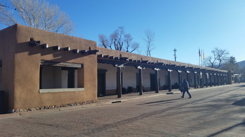 The brown, timber-beamed portals at the Palace of the Governors on Santa Fe's Historic Plaza.