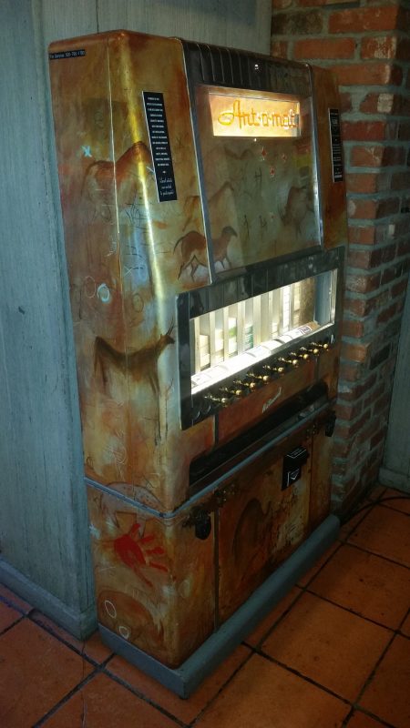 A converted old art-o-mat cigarette vending machine now used to dispense small and unique works of art.