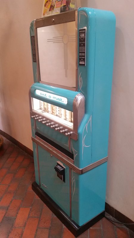 A converted old art-o-mat cigarette vending machine now used to dispense small and unique works of art.