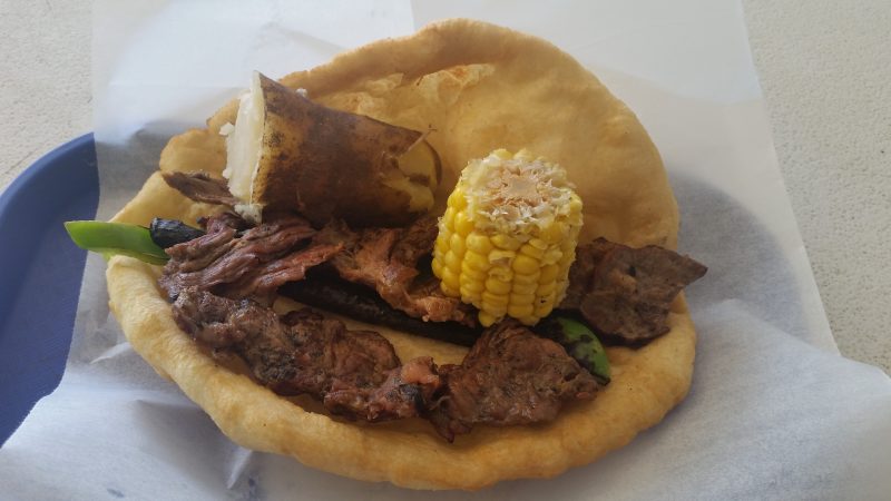 Mutton, corn on the cob, green chile and boiled jacket potato on frybread.