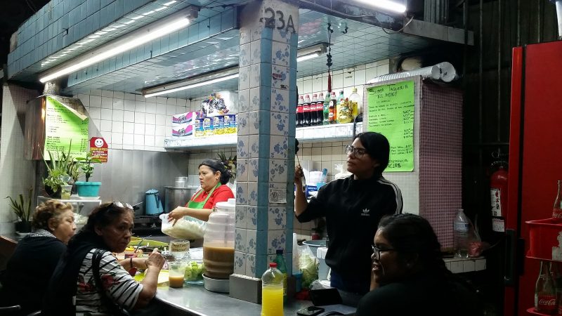 a group of women at an all-night taco stand in Mazatlan.