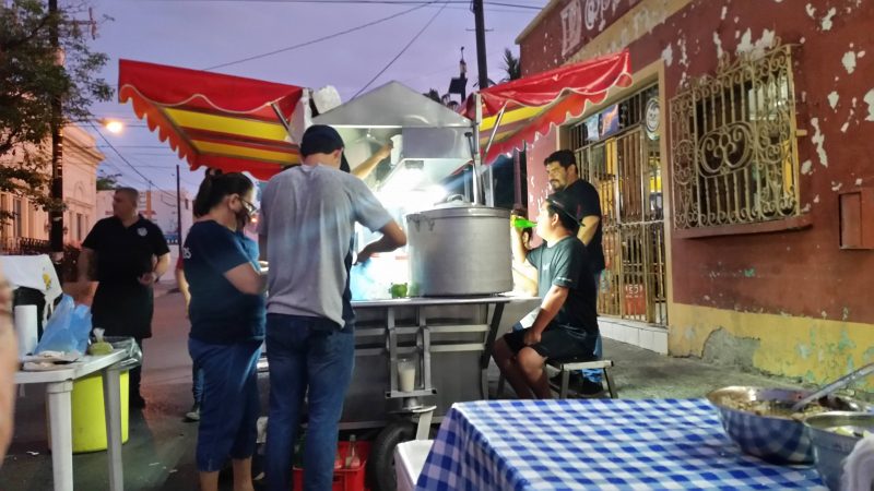 Patrons and workers surrounding a popular late night taqueria in Mazatlan, Mexico.