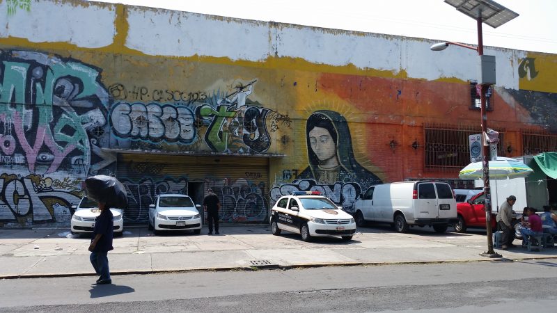 Mexico City's street art, as seen on the side of a building with the Virgin Mary painted on it.