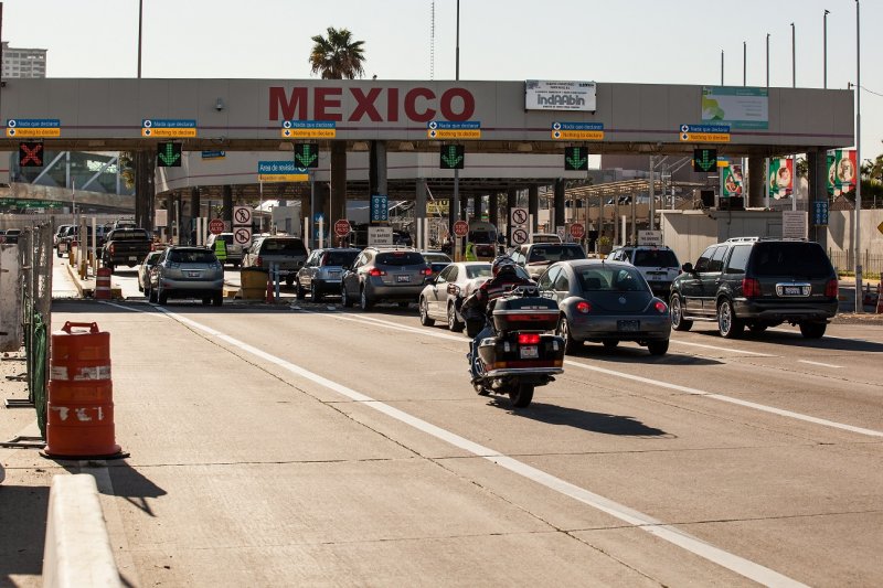 Vehicles lining up to enter into Mexico