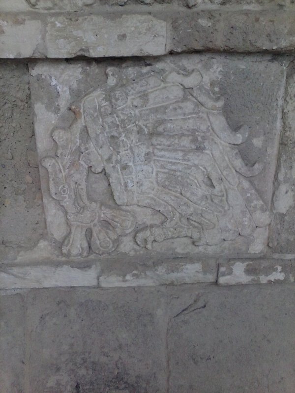 carved stone panel of a soldier in Tula, Mexico.