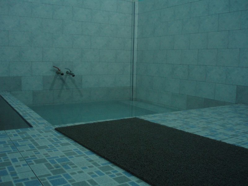 A blue-tiled bathtub filled with steaming hot water near Almolonga, Guatemala.