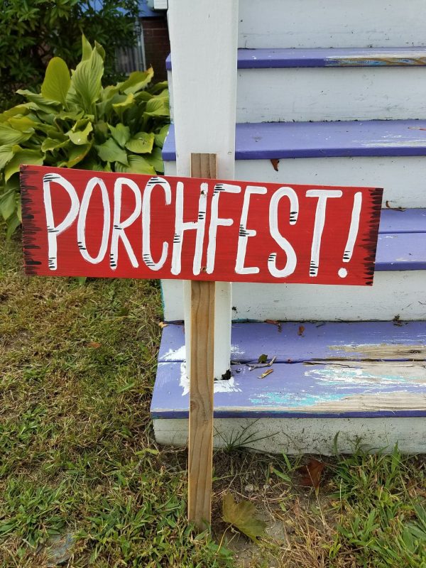 A "Porchfest" sign against some blue-painted steps.